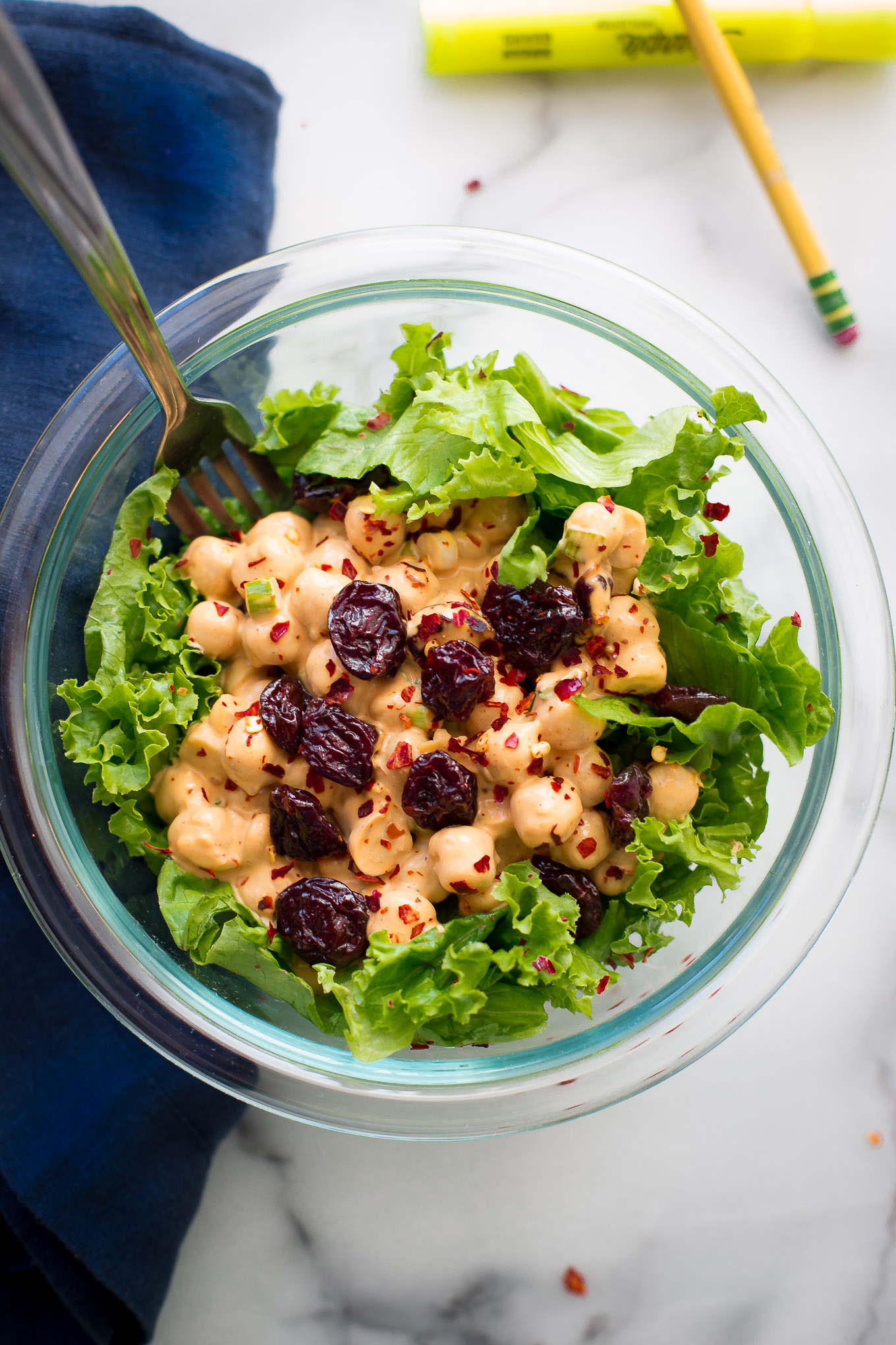 Healthy chipotle chickpea salad. Made with delicious real food with only 5 ingredients. Chickpeas, green onions, chipotle vegenaise, red pepper flakes, dried cherries and sea salt. Vegan. tasteofyummy.com