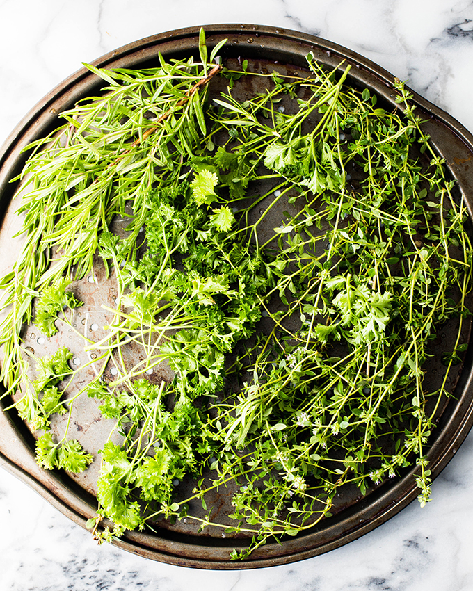 fresh thyme and rosemary on a tray