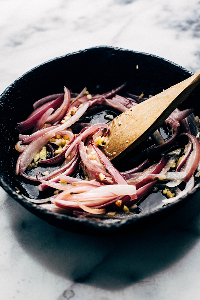 red onions, and garlic in frying skillet