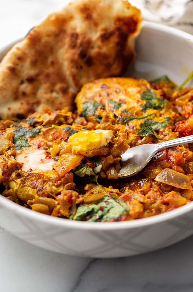 spiced egg curry with baby kale