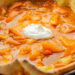 apricot oven pancake with a dollop of sour cream