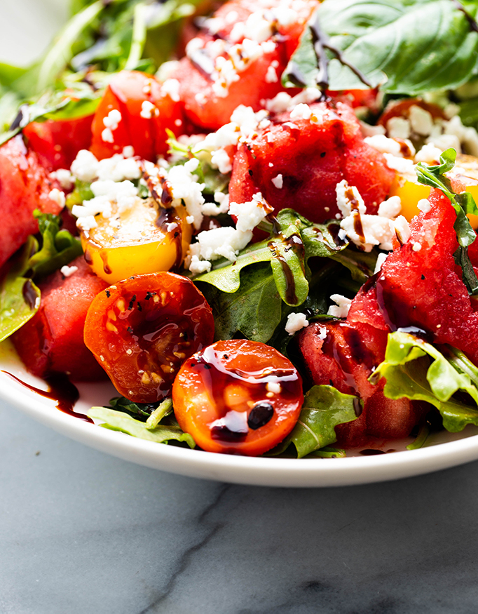 watermelon salad topped with organic feta cheese drizzled with balsamic glaze